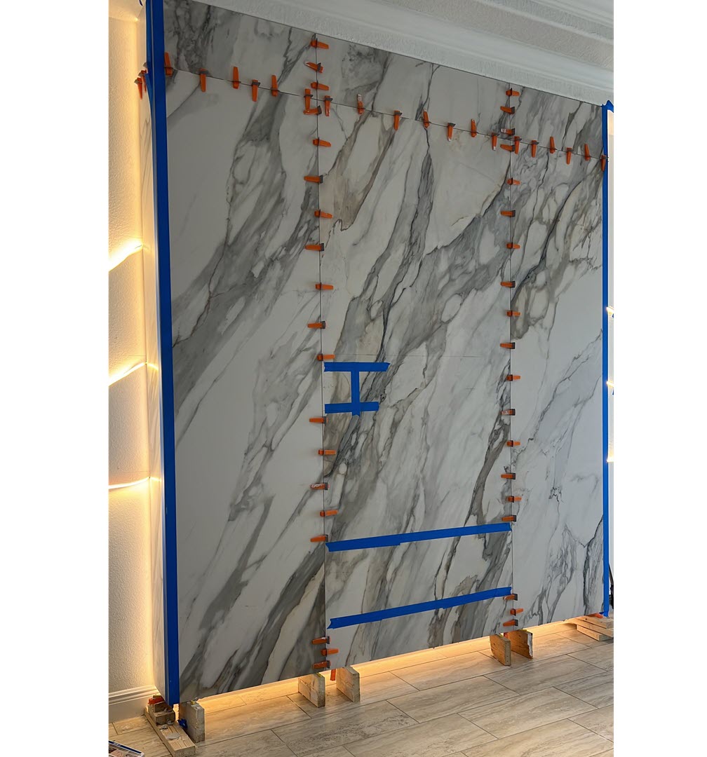 Perpetual venato gold-future fireplace+tv wall-emphasis on vein cordination